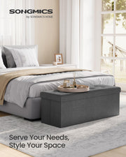 SONGMICS Ottoman Storage Box, Foldable Tufted Bench, 131L | 110 x 38 x 38 cm, Removable Divider, Foot Rest for Entryway Living Room, Grey and Black, Minota Collection, LSF80GYZ